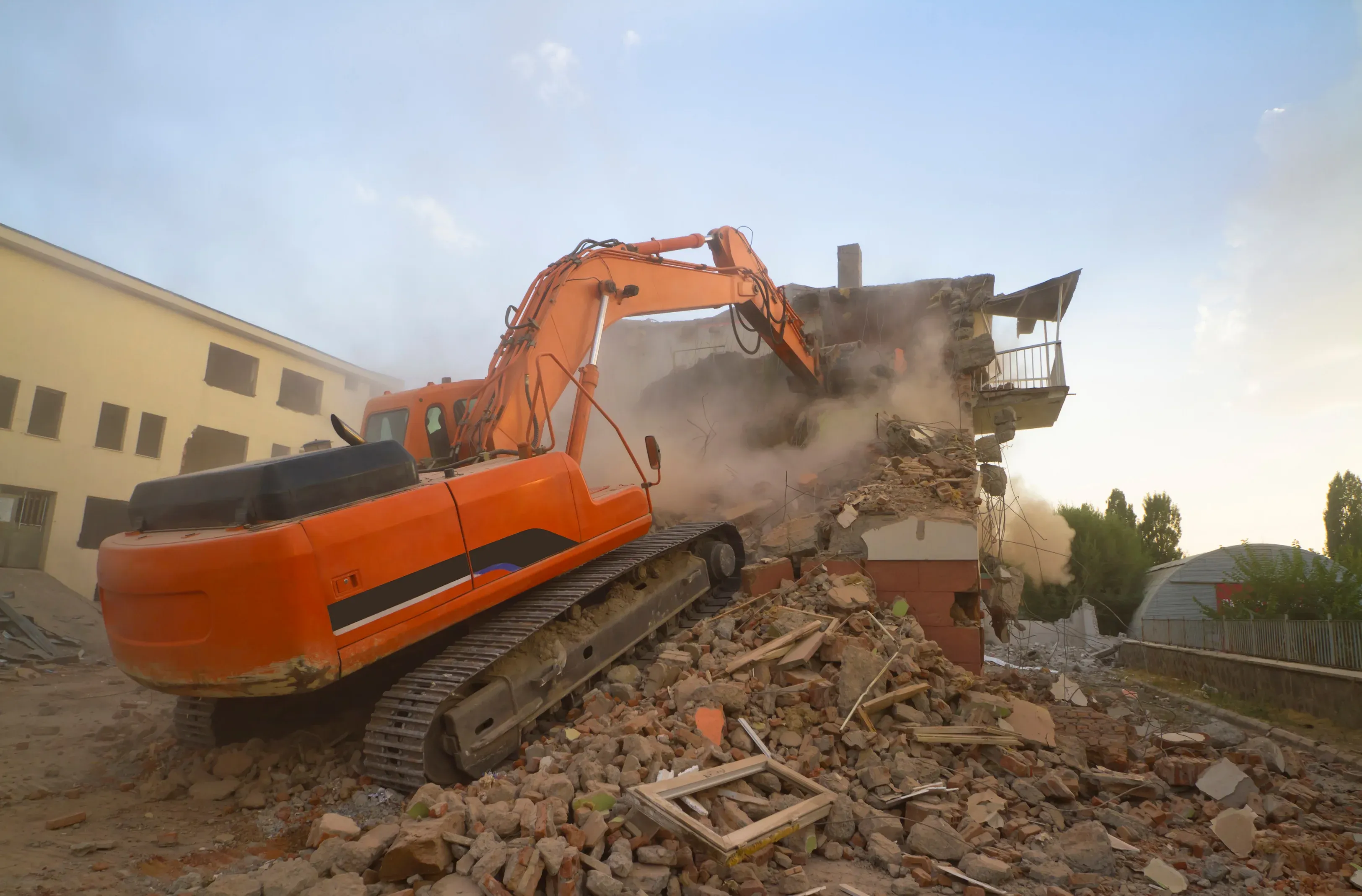 Licensed demolition contractor clearing a building site near Townsville
