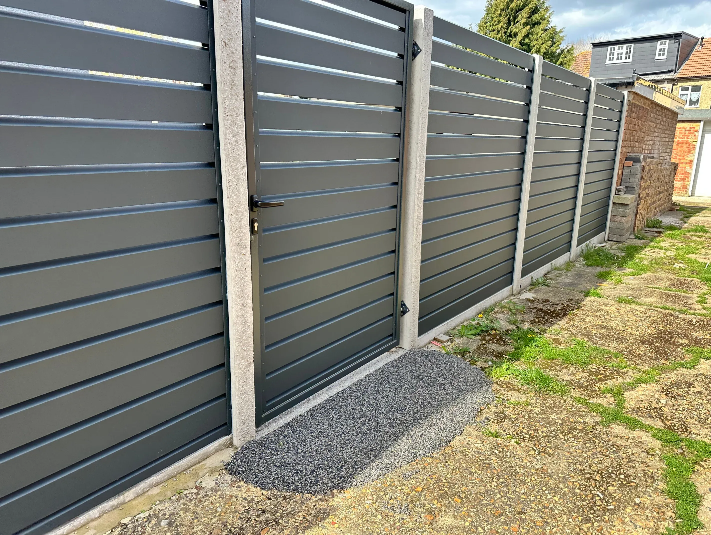 Modern aluminium slat fence and gate in Gold Coast